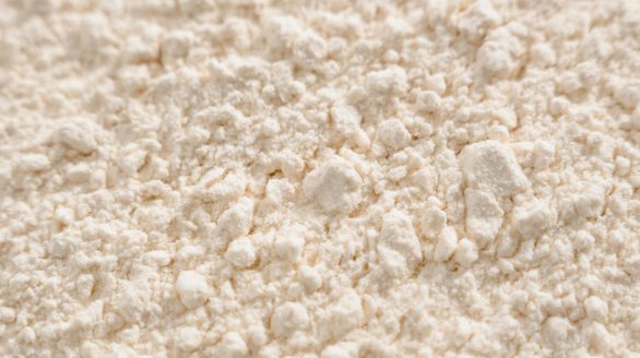 Detailed close-up of a white powder texture, resembling flour or sugar.